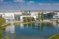 View of the Munich Trade Fair Centre and the lake in front of it.